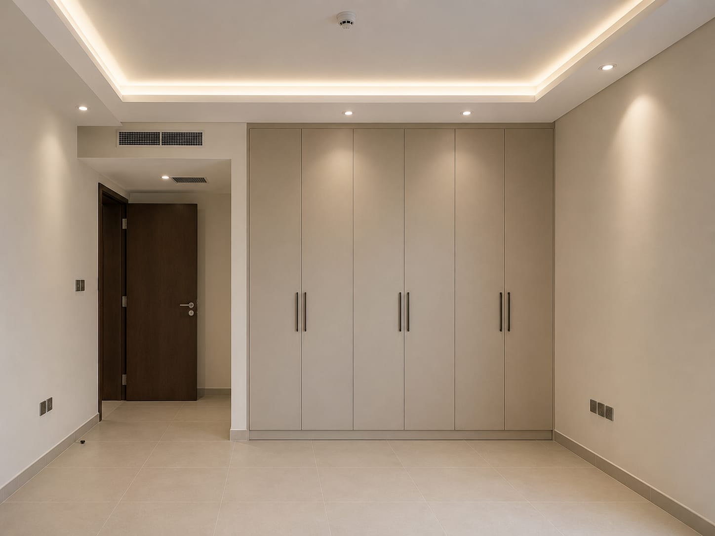 A Bare Wall Built Out Into Full-Height Wardrobes. after renovation