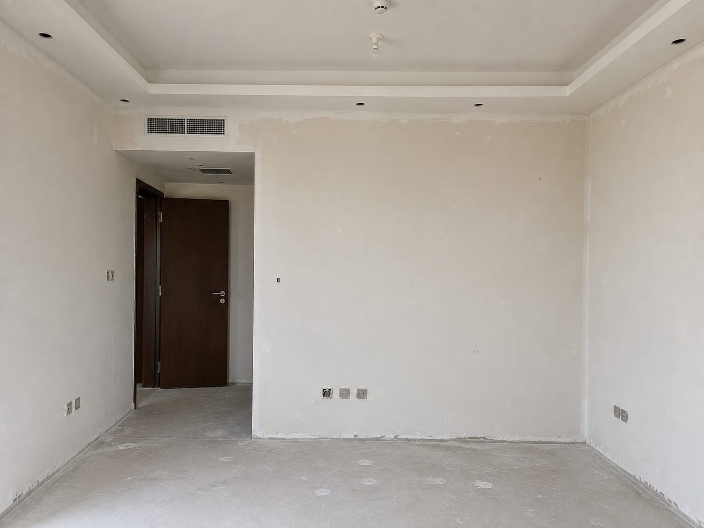 A Bare Wall Built Out Into Full-Height Wardrobes. before renovation